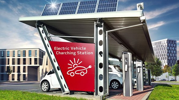 Die Ladestation für Elektroautos zeigt eine rote Wand mit einem Symbol, das ein aufgeladenes Auto darstellt.